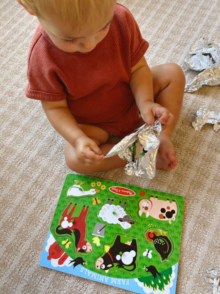 Educational Summer Activities for Toddlers: Wrap puzzle pieces for a surprise